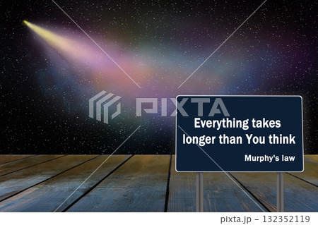 Murphy's law. Famous phrase written on dark surface. Comet flying in distance 132352119