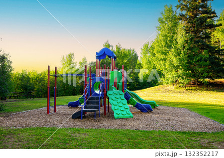 Empty colorful playground in the summer park in hot day. Empty colorful playground in the summer park in hot day. 132352217