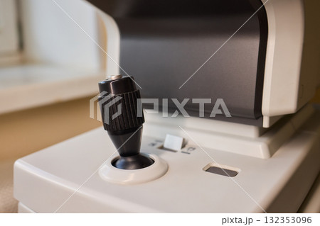 Detailed closeup of a Microphone and Recording Equipment situated at a Professional Studio Detailed closeup of a Microphone and Recording Equipment situated at a Professional Studio 132353096