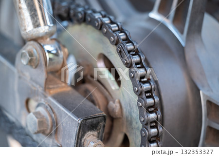 Close up of dirty used motorbike chain. Rust motorcycle chain needs to be cleaned and greased 132353327