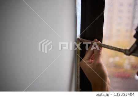 The Process of Applying Sealant During the Installation of Windows in Buildings and Homes 132353404