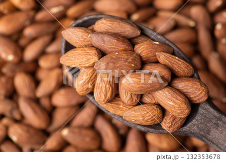 Almond nuts in a spoon. Cooking with almonds concept Almond nuts in a spoon. Cooking with almonds concept 132353678