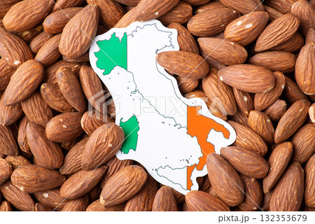 Map and flag of Italy on almonds. Origin of almond concept, growing nuts in Italy Map and flag of Italy on almonds. Origin of almond concept, growing nuts in Italy 132353679
