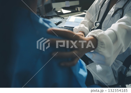 Male doctors shake hands with patients encouraging each other and praying for blessings. To offer love, concern, and encouragement while checking the patient's health. concept of medicine 132354185