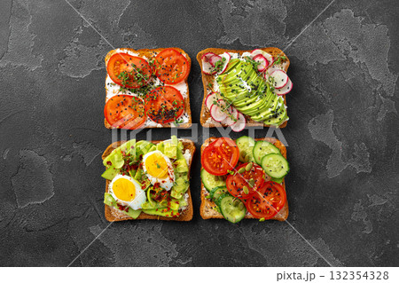 Assortment of vegan sandwiches with avocado and tomatoes 132354328