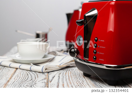 Close up of red kitchen .appliances on kitchen table Close up of red kitchen .appliances on kitchen table 132354401