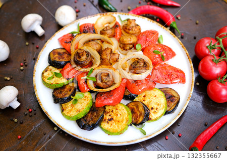 Delicious grilled vegetables on plate on table close-up 132355667