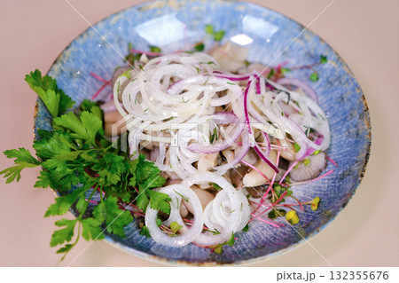 Onion pickled mushrooms, Lactarius resimus, autumn harvest. Homemade pickled mushrooms, marinated red onion rings pepper, garlic, and bay leaf. Salted Lactarius resimus with oil and fresh chopped dill 132355676