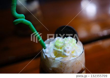Biscoff coffee with ingredients , whipped cream, cookies spread on white background.Large image for banner 132355709