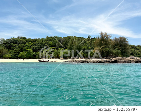 Tropical view of Bon Island, Thailand with turquoise sea, sandy beach and traditional boat. Vacation and tourism concept. 132355797