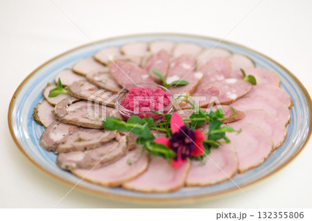 Appetizers with differents antipasti, charcuterie, snacks and red wine. Sausage, ham, tapas, olives and crackers for buffet party. Top view, flat lay 132355806