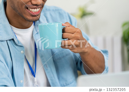 Sustainability and Coffee Break. A young professional enjoying coffee while discussing sustainable business strategies. Sustainability and Coffee Break. A young professional enjoying coffee while discussing sustainable business strategies. 132357205