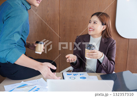 Business meeting with coffee, documents, and conversation Business meeting with coffee, documents, and conversation 132357310