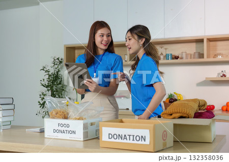 Volunteers Collaborating on Donations. Engaging in community support and organization. 132358036