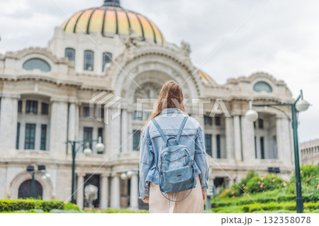 Woman tourist standing in front of Palacio de Bellas Artes in Mexico City, capturing the beauty of Mexican culture, architecture, and iconic travel landmarks Woman tourist standing in front of Palacio de Bellas Artes in Mexico City, capturing the beauty of Mexican culture, architecture, and iconic travel landmarks 132358078