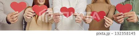 Banner with people holding red heart shaped cards showing love and gratitude on Valentine's Day 132358145