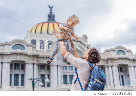 Father tourist lifting his little son in front of Palacio de Bellas Artes in Mexico City, enjoying family travel, playful bonding, and cultural exploration. Family vacation and tourism concept 132358185