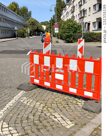 Protective road barrier with signal lights on a city street Protective road barrier with signal lights on a city street 132358199