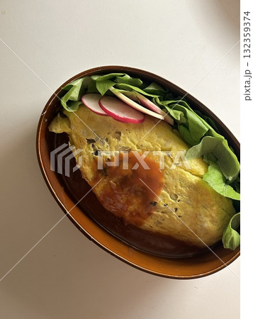 A traditional Korean dosirak, beautifully arranged with rice, assorted banchan, and savory proteins. Balanced and visually inviting, its a portable meal packed with vibrant flavors. A traditional Korean dosirak, beautifully arranged with rice, assorted banchan, and savory proteins. Balanced and visually inviting, its a portable meal packed with vibrant flavors. 132359374
