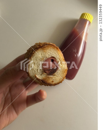 Korean corn dog, a crispy snack coated in a sweet batter, often stuffed with sausage, cheese, or both. Topped with sugar, ketchup, or mustard for a delightful mix of flavors and textures. Korean corn dog, a crispy snack coated in a sweet batter, often stuffed with sausage, cheese, or both. Topped with sugar, ketchup, or mustard for a delightful mix of flavors and textures. 132359449