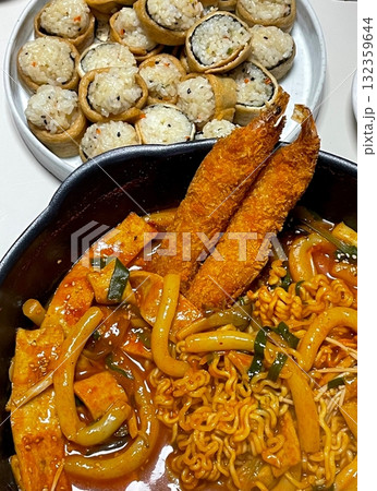 Rabokki, Korean style Stir-fried Instant Noodle : This dish is tteokbokki with ramen noodles. Tteokbokki is a spicy dish made with rice cake, vegetables, and fish cake, all stir-fried together in a go 132359644