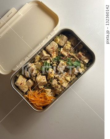 A traditional Korean dosirak, beautifully arranged with rice, assorted banchan, and savory proteins. Balanced and visually inviting, its a portable meal packed with vibrant flavors. A traditional Korean dosirak, beautifully arranged with rice, assorted banchan, and savory proteins. Balanced and visually inviting, its a portable meal packed with vibrant flavors. 132360142