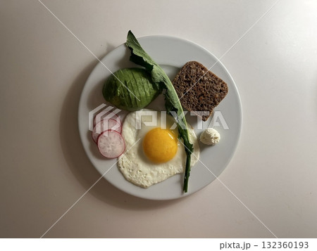 A delightful brunch spread featuring a mix of savory and sweet bites. perfectly toasted bread, fresh fruits, soft scrambled eggs, and a refreshing drink to brighten your late morning. 132360193