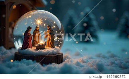 A snow globe displaying three nativity scenes, including the Holy Family and the Magi, set against a snowy backdrop 132360871