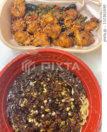 A classic Korean-Chinese combo of jajangmyeon with thick, chewy noodles coated in rich black bean sauce, served alongside crispy tangsuyuk, deep-fried pork with sweet and sour sauce. A classic Korean-Chinese combo of jajangmyeon with thick, chewy noodles coated in rich black bean sauce, served alongside crispy tangsuyuk, deep-fried pork with sweet and sour sauce. 132362690