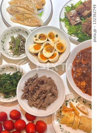 Warm and comforting jibbap (home-cooked Korean meal) with a spread of rice, soup, and banchan, offering a perfect harmony of flavor, tradition, and heartwarming nourishment in every bite. 132362749