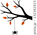 a wooden silhouette with a Halloween spider hanging from it 132362815