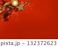 Christmas decorations on a red background in the corner of postcards 132372623