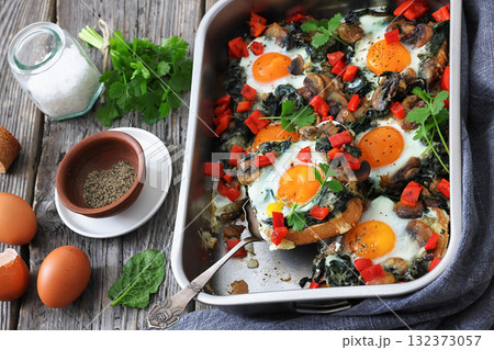 baked eggs with spinach, mushroom, sweet pepper baked eggs with spinach, mushroom, sweet pepper 132373057