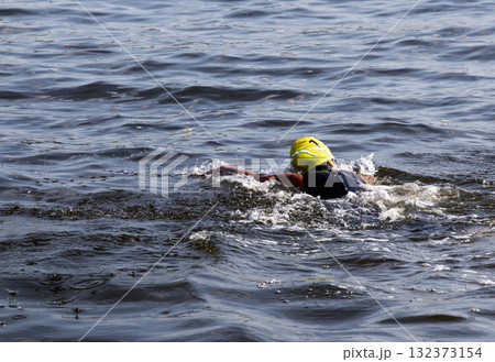 Swimmer Gliding Through the Calm Water iof the bay n Morning Light Swimmer Gliding Through the Calm Water iof the bay n Morning Light 132373154