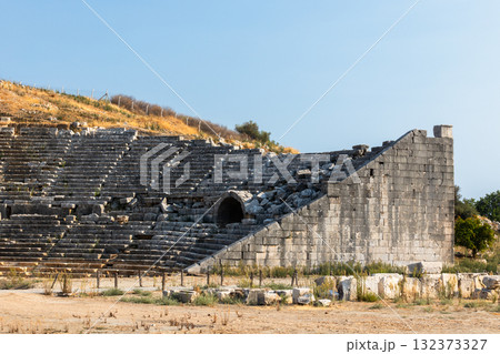 Roman Theatre of Patara ancient city. A historic stone amphitheater ruins Roman Theatre of Patara ancient city. A historic stone amphitheater ruins 132373327