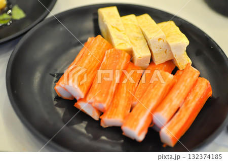 Japanese omelete, japanese omelette or sweet egg or sweetened egg or tamagoyaki or Japanese rolled omelette and imitation crab or crab stick 132374185