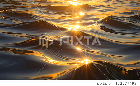 Golden Sunlight Reflecting on the Ocean Waves at Sunset Golden Sunlight Reflecting on the Ocean Waves at Sunset 132377495