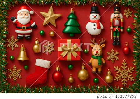 Festive Christmas Flat Lay with Figurines and Ornaments on Red 132377855