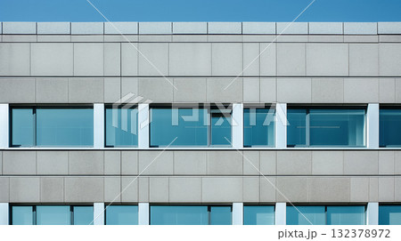 Modern architectural detail of a building's facade showing a row of blue tinted windows against a clear sky. Modern architectural detail of a building's facade showing a row of blue tinted windows against a clear sky. 132378972
