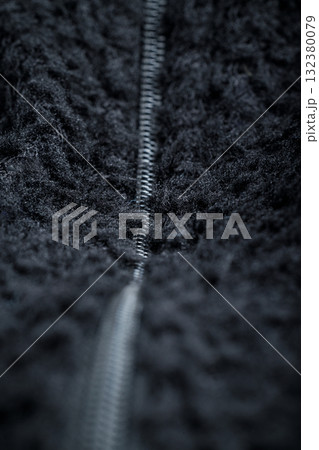 Zipper on black fleece background close-up 132380079