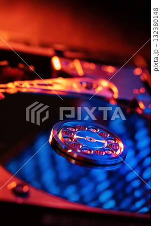 A hard disk with a blue binary code A hard disk with a blue binary code 132380148