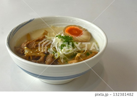 Tonkotsu ramen or Japanese yellow noodles topping slice barbecue pork and egg in Miso soy sauce bone soup on bowl Tonkotsu ramen or Japanese yellow noodles topping slice barbecue pork and egg in Miso soy sauce bone soup on bowl 132381482