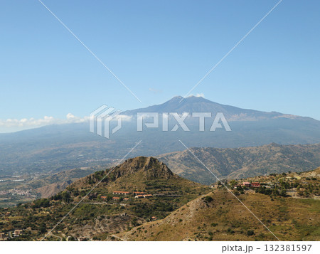 Sicilian rural landscape with Etna volcano  at sunset in Sicily, Italy Sicilian rural landscape with Etna volcano  at sunset in Sicily, Italy 132381597