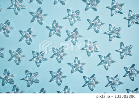 Pattern of transparent stars on a blue background. Pattern of transparent stars on a blue background. 132382880