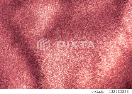 Burgundy color genuine leather as a background macro photo. 132383228