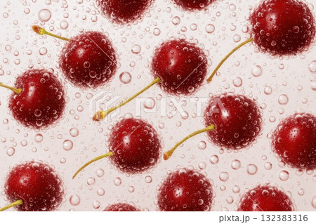 Fresh cherries submerged in sparkling water with bubbles on pink background 132383316