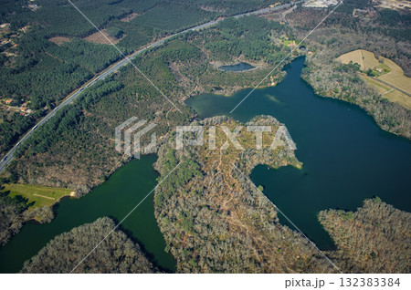 Scenic aerial view of Etang d'Yrieux and nearby landscapes in Ondres Scenic aerial view of Etang d'Yrieux and nearby landscapes in Ondres 132383384