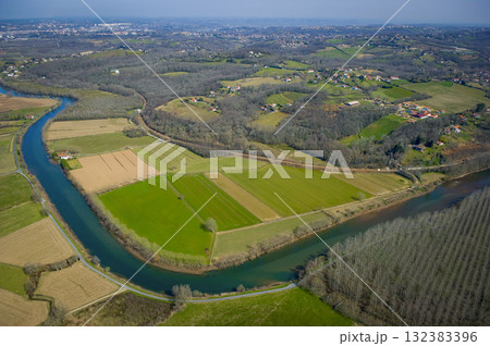 Scenic view of the Nive River and surrounding fields near Villefranque Scenic view of the Nive River and surrounding fields near Villefranque 132383396