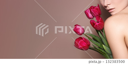 Beautiful sexy Blonde Woman with luxury Make-up. Girl with Spring Flowers Bouquet. Style for Womans Day or Valentines Beautiful sexy Blonde Woman with luxury Make-up. Girl with Spring Flowers Bouquet. Style for Womans Day or Valentines 132383500