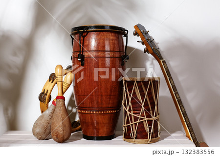 Composition of musical ethnic instrument. Maracas, tambourine, conga and ethnic drum. Percussion rhytm instruments Composition of musical ethnic instrument. Maracas, tambourine, conga and ethnic drum. Percussion rhytm instruments 132383556
